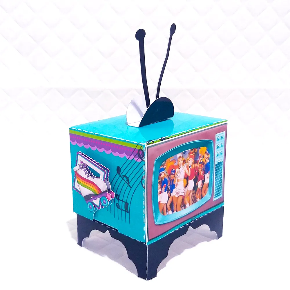 Segundo modelo de gabarito digital para lembrancinha de festa retrô com elementos de cubos mágicos e cores neon vibrantes, exibindo as linhas de marcação para dobras, encaixes e recortes limpos.