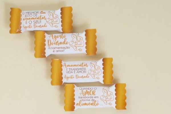 Gabarito digital de rótulos e embalagens para balas personalizadas com ilustrações de amamentação, corações e o laço dourado símbolo da campanha, exibindo as linhas estruturadas de contorno para recorte.