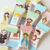 Alternativo: Embalagens de papel para balas personalizadas com ilustrações católicas de Nossa Senhora Aparecida e São Jorge, exibindo marcas de corte e dobras laterais serrilhadas em arquivo digital de corte.