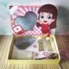 Maquete digital de embalagem personalizada tema confeitaria com o nome Giovanna, exibindo marcações de dobra e corte com estampas de granulados coloridos.
