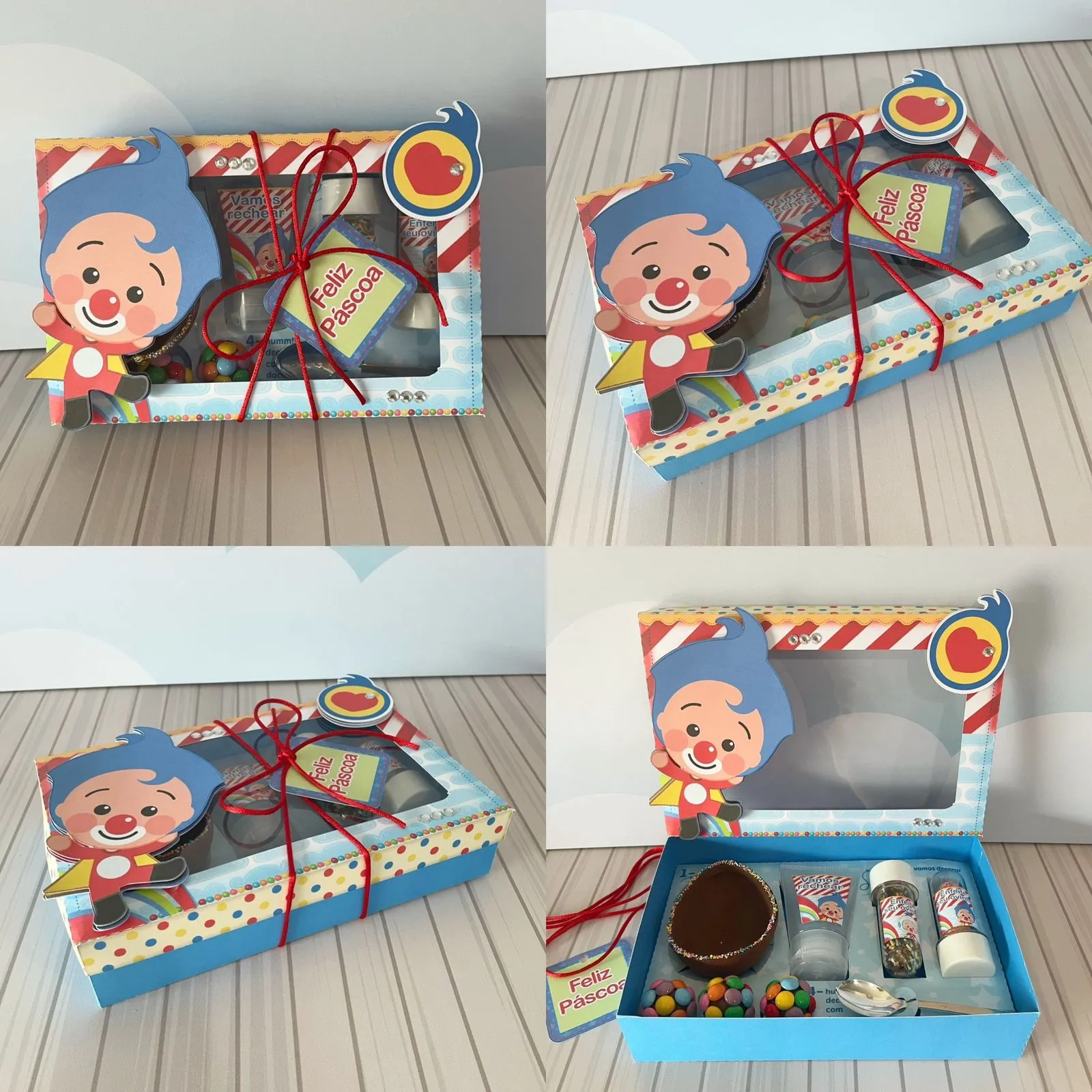 Caixinha cartonada do kit mini confeiteiro com berço recortado, estampa do palhaço Plim Plim sorridente na tampa, arco-íris colorido ao fundo e espaços para tubetes de confeitos e bisnaga de brigadeiro em arquivo digital de corte.