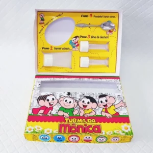 Embalagem interativa com berço para bisnaga de brigadeiro e tubetes com confetes da Turma da Mônica. Arquivo de corte digital em Studio e PDF.