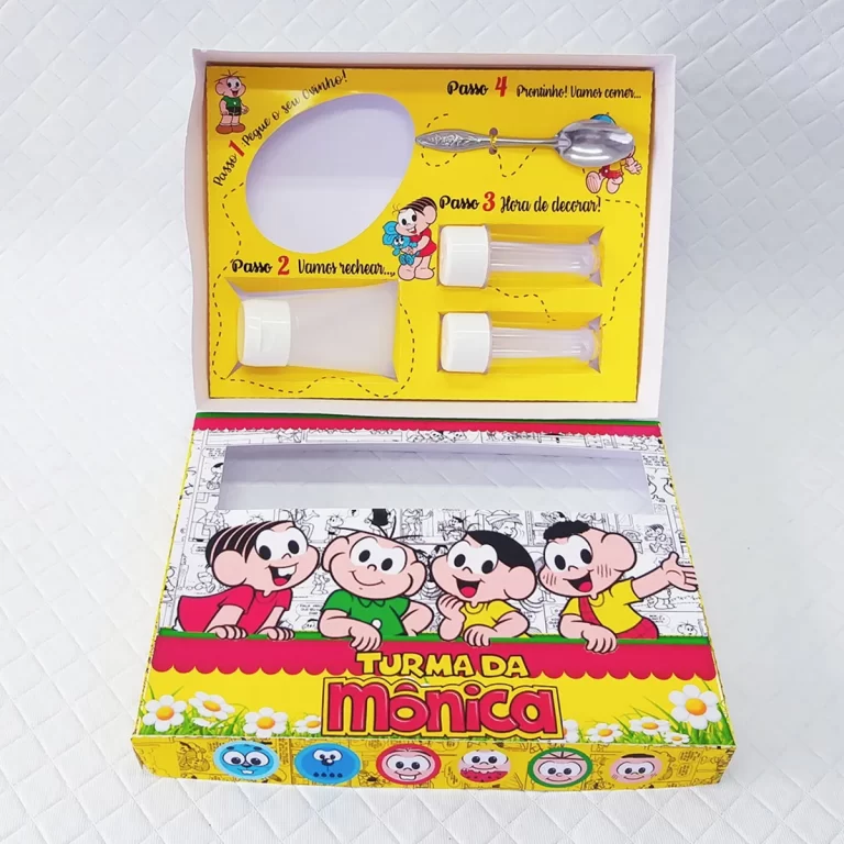 Embalagem interativa com berço para bisnaga de brigadeiro e tubetes com confetes da Turma da Mônica. Arquivo de corte digital em Studio e PDF.