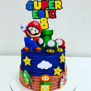 Arquivo de corte digital de topo de bolo no tema Super Mario Bros em formato Studio para Silhouette, mostrando o personagem Mario, o dinossauro Yoshi, blocos de interrogação, moedas douradas, canos verdes e cogumelos dispostos em camadas prontas para recorte tridimensional.